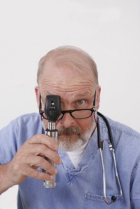 doctor with ophthalmoscope